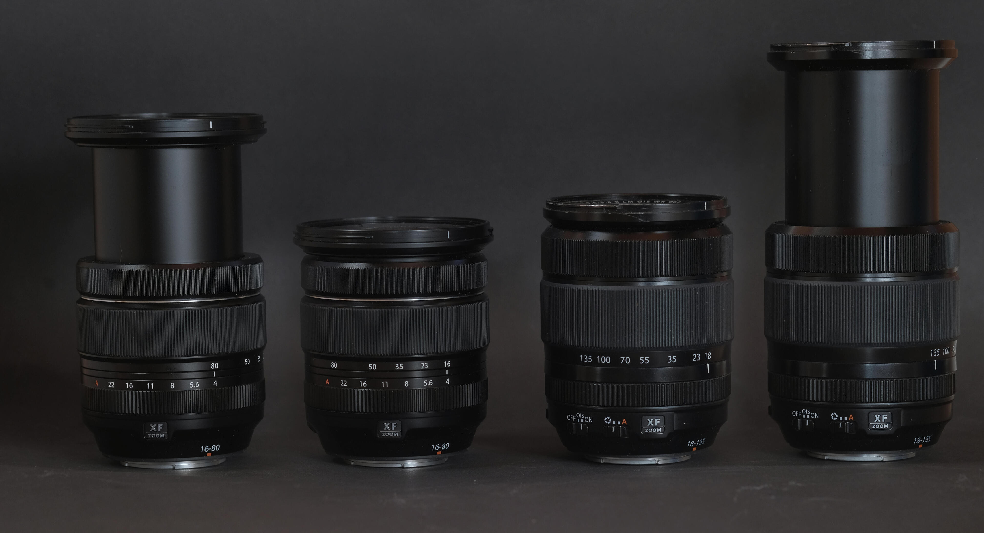 A picture of the two lenses from the side, both collapsed and extended